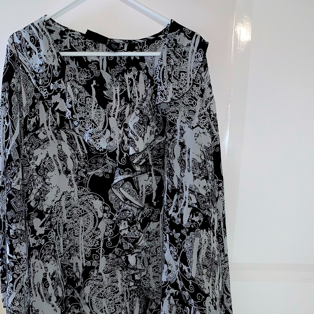 Black in white blouse. Flowery and very lightweight. Will need a cami underneath